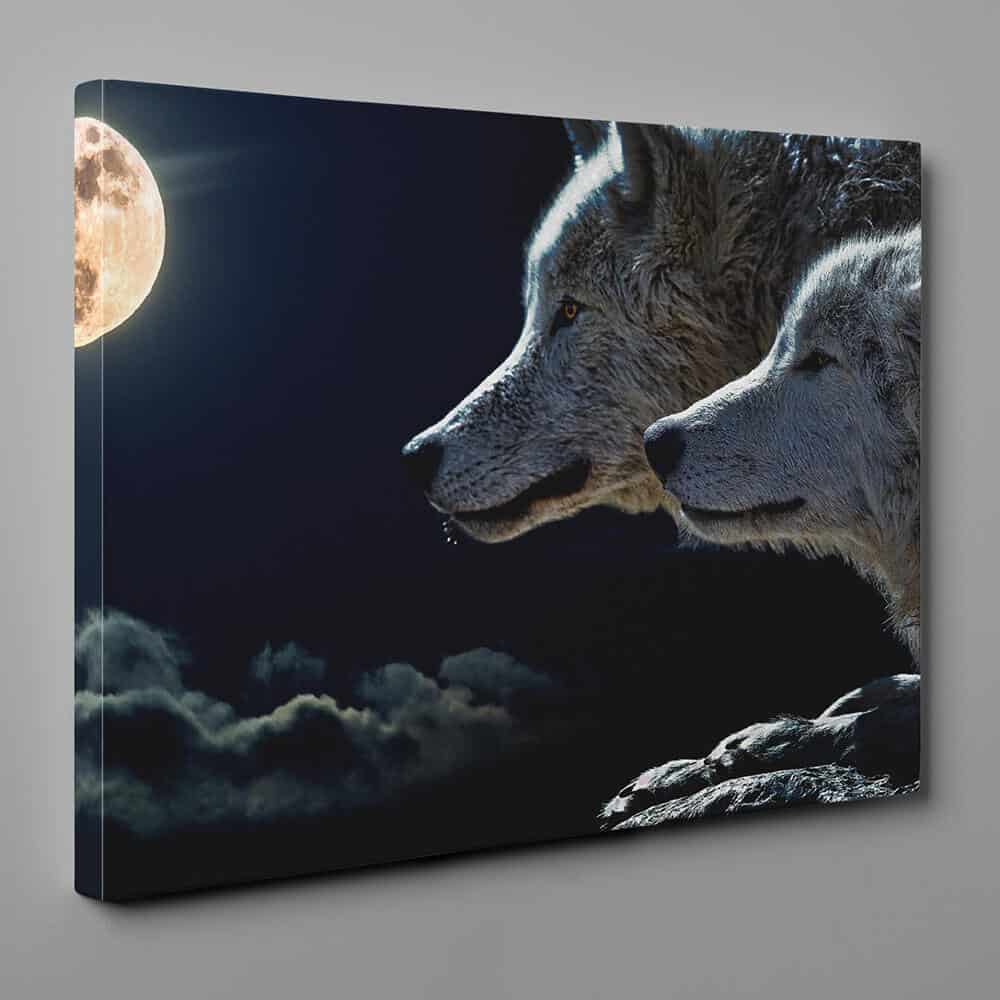 a canvas print of a couple of wolf under the full moon